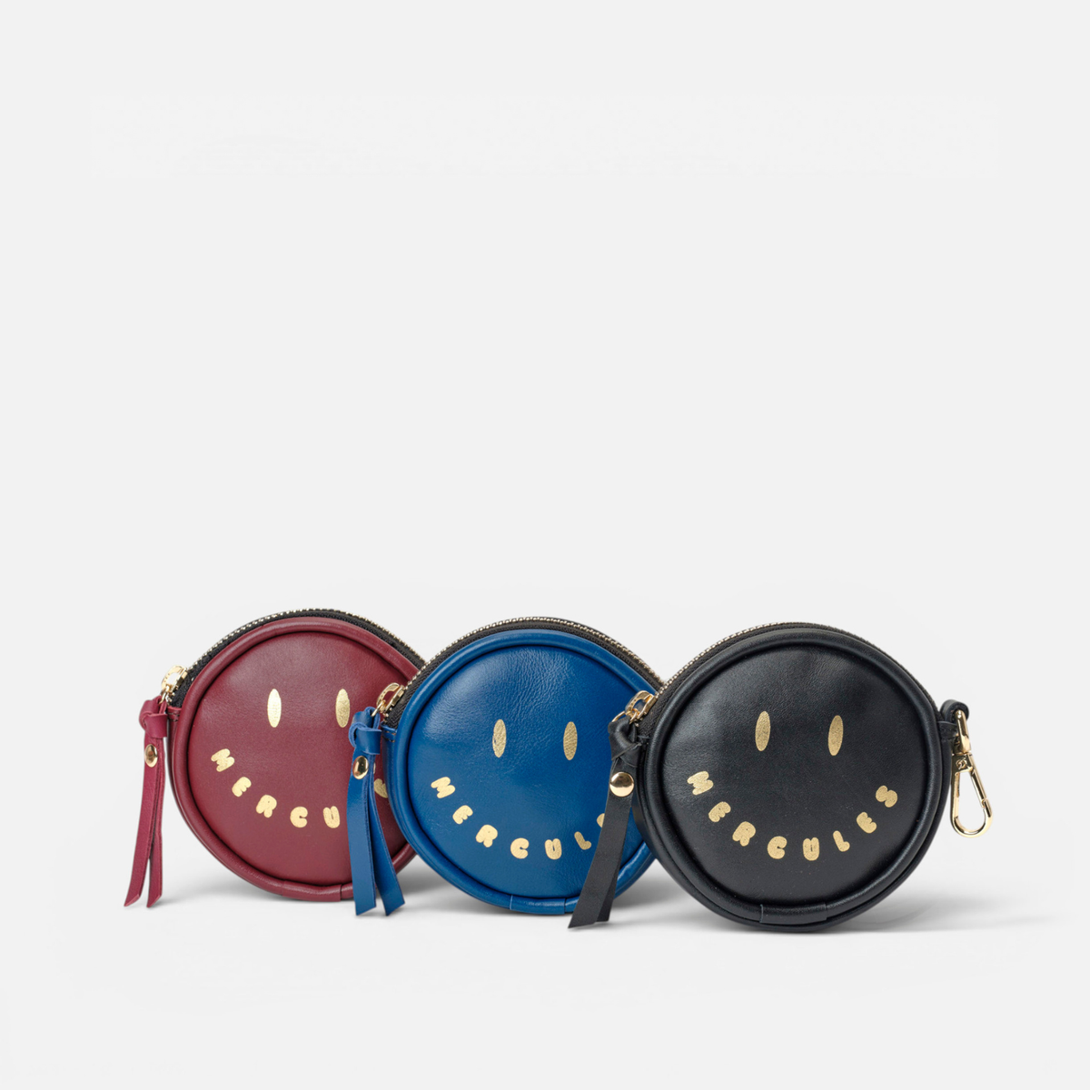 Smiley round leather coin purses, by Mercules