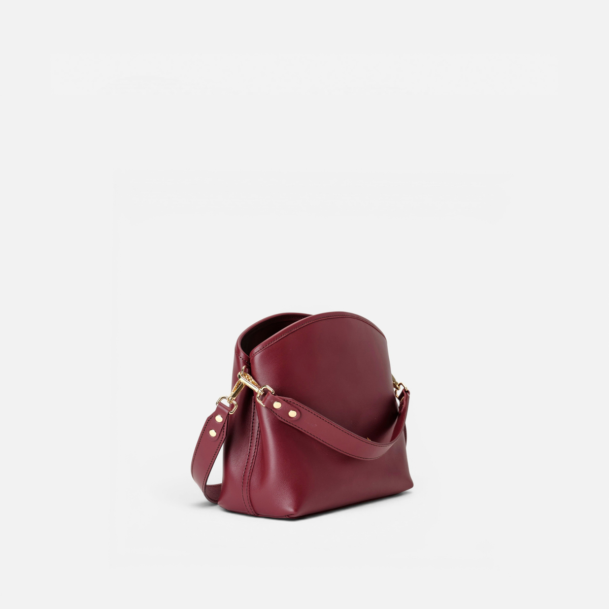 Bolso de mano y bandolera Juniper color burdeos, de Mercules